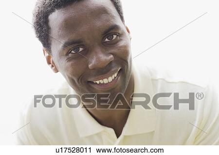 Studio portrait of man smiling View Large Photo Image Stock Image - Studio portrait of man smiling. Fotosearch