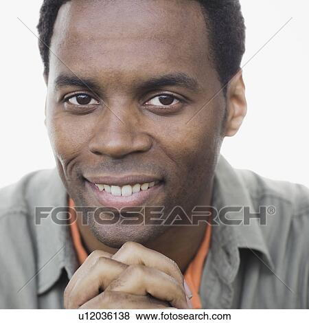 Studio portrait of man smiling View Large Photo Image Stock Photo - Studio portrait of man smiling. Fotosearch