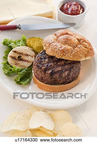 Stock Image - Studio shot of hamburger. Fotosearch