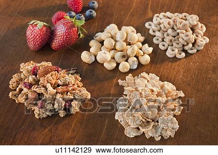 Stock Photo - "Studio shot of Whole grains, cereal, puffed rice, corn puffs, granola, flakes". Fotosearch