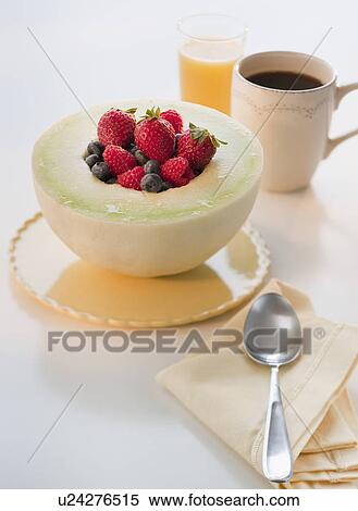 Stock Photography - Studio shot of yogurt with fruits. Fotosearch