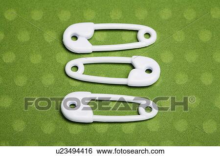 Stock Photograph - Three safety pins. Fotosearch