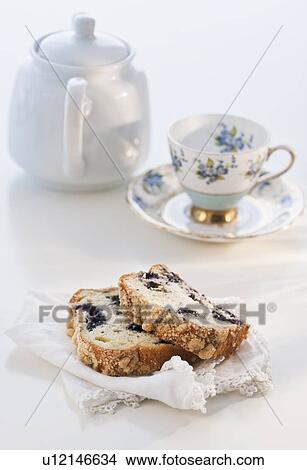 "Two slices of cake, teapot and tea cup" View Large Photo Image Picture - "Two slices of cake, teapot and tea cup". Fotosearch