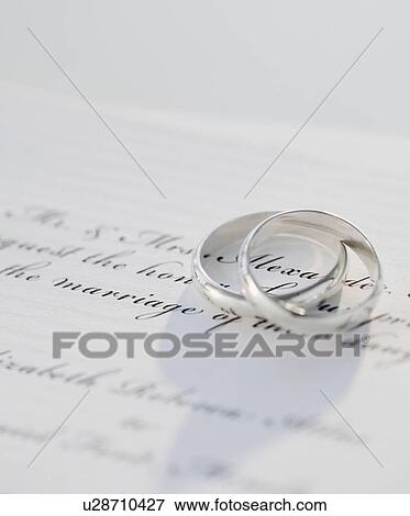 "Two wedding rings on marriage certificate, studio shot" View Large Photo Image Stock Photo - "Two wedding rings on marriage certificate, studio shot". Fotosearch