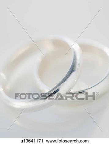 "Two wedding rings, studio shot" View Large Photo Image Stock Image - "Two wedding rings, studio shot". Fotosearch