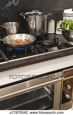 Vegetables in frying pan on cooker View Large Photo Image Stock Image - Vegetables in frying pan on cooker. Fotosearch