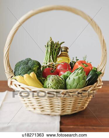 Wicker basket filled with vegetables View Large Photo Image Stock Image - Wicker basket filled with vegetables. Fotosearch