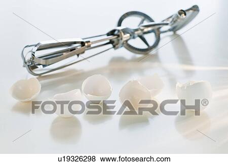 Wire whisk and eggshells View Large Photo Image Stock Photo - Wire whisk and eggshells. Fotosearch