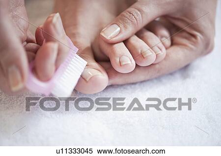 Woman caring for her toenails View Large Photo Image Stock Photography - Woman caring for her toenails. Fotosearch