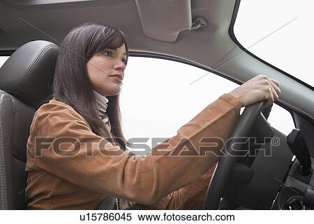 Woman driving car View Large Photo Image Stock Photography - Woman driving car. Fotosearch