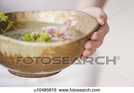 Woman holding aromatherapy bowl View Large Photo Image Stock Photo - Woman holding aromatherapy bowl. Fotosearch