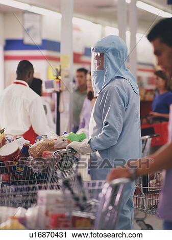 Woman in protective workwear in supermarket View Large Photo Image Stock Image - Woman in protective workwear in supermarket. Fotosearch