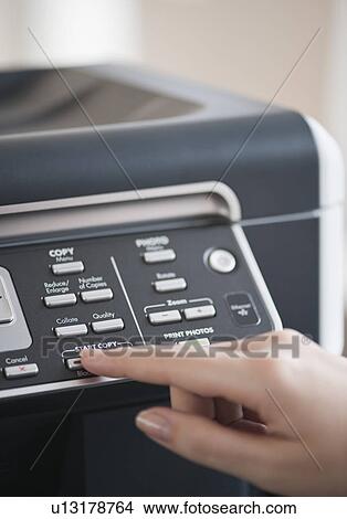 "Woman using photocopier, close-up" View Large Photo Image Picture - "Woman using photocopier, close-up". Fotosearch
