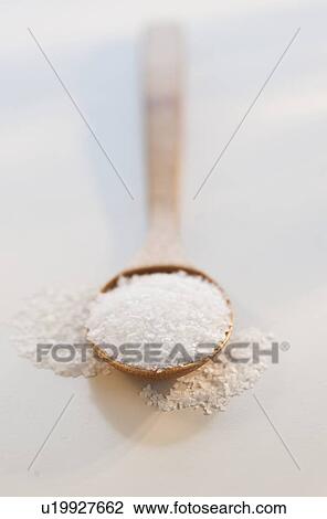 Stock Image - "Wooden spoon of salt, studio shot". Fotosearch