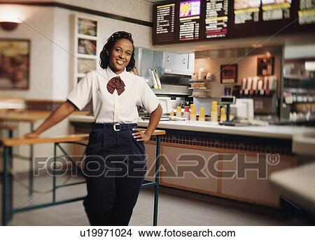 Picture - "Young woman in restaurant, portrait". Fotosearch