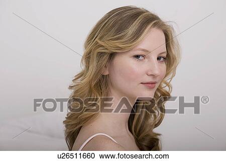 "Young woman in string top, portrait" View Large Photo Image Stock Image - "Young woman in string top, portrait". Fotosearch