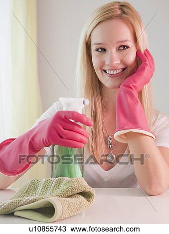 Young woman preparing to clean house View Large Photo Image Stock Image - Young woman preparing to clean house. Fotosearch