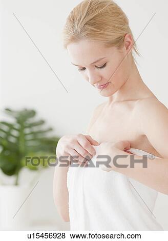 Young woman wrapped in towel View Large Photo Image Stock Photo - Young woman wrapped in towel. Fotosearch