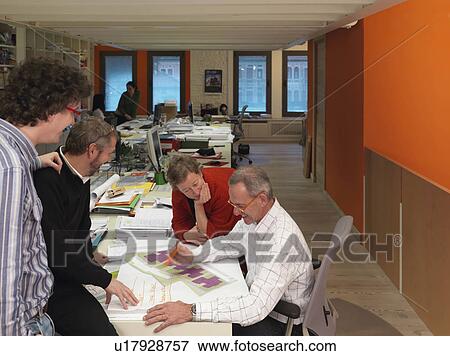 Stock Photo - Architects discussing project. Fotosearch