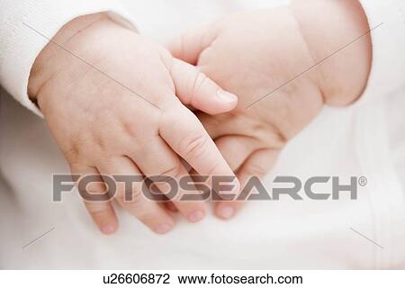 Stock Image - Baby hands. Fotosearch