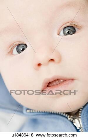 Stock Photo - Baby looking into camera. Fotosearch