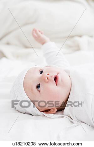 Stock Photo - Baby looking up. Fotosearch