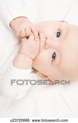 Stock Photograph - Baby smiling into camera. Fotosearch