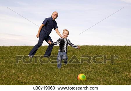 Boy and father play ball View Large Photo Image Stock Image - Boy and father play ball. Fotosearch
