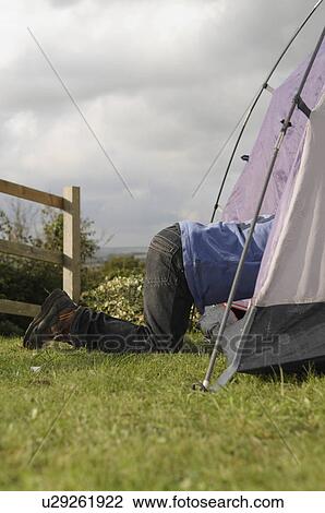 Boy climbing into tent View Large Photo Image Stock Image - Boy climbing into tent. Fotosearch