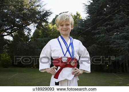 "Boy in Karate Kit, with medals" View Large Photo Image Stock Image - "Boy in Karate Kit, with medals". Fotosearch