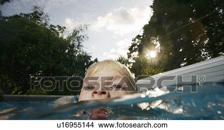 Picture - Boy in pool. Fotosearch