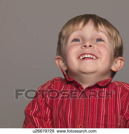 Stock Photo - "Boy laughing, portrait, close-up". Fotosearch