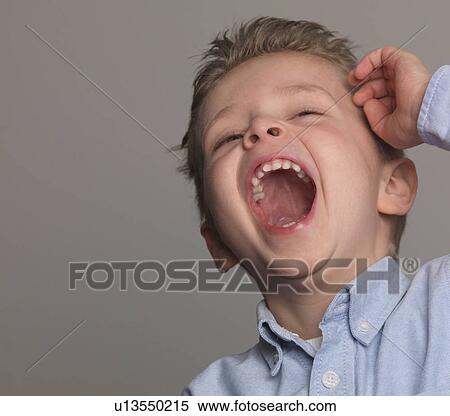 Stock Photography - "Boy laughing, portrait, close-up". Fotosearch
