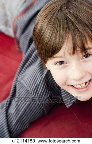 Boy looking up to camera View Large Photo Image Stock Image - Boy looking up to camera. Fotosearch