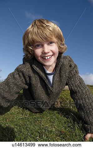 Stock Photo - Boy on grass. Fotosearch