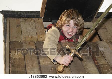 Boy playing in treehouse View Large Photo Image Stock Image - Boy playing in treehouse. Fotosearch
