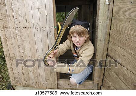 Boy playing in treehouse View Large Photo Image Stock Photograph - Boy playing in treehouse. Fotosearch