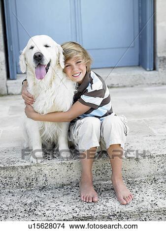 Boy with dog on door step View Large Photo Image Picture - Boy with dog on door step. Fotosearch