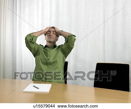 Picture - Business man conference table. Fotosearch