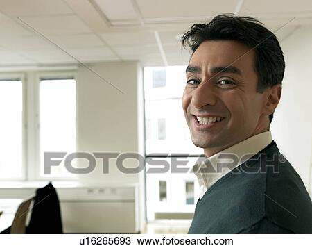 Stock Image - Business man smiling. Fotosearch