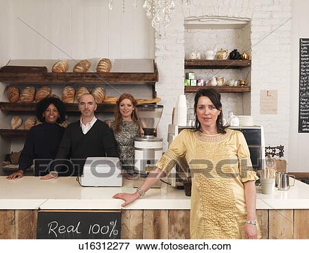 Business owner posing with employees View Large Photo Image Stock Photo - Business owner posing with employees. Fotosearch