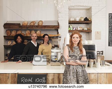 Business owner posing with employees View Large Photo Image Stock Photograph - Business owner posing with employees. Fotosearch