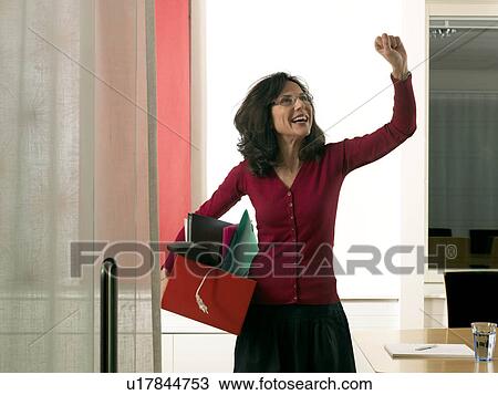 Stock Image - Business woman cheering. Fotosearch
