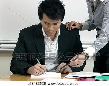 Business woman helping trainee View Large Photo Image Stock Photograph - Business woman helping trainee. Fotosearch