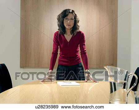 Stock Photo - Business woman in meeting room. Fotosearch