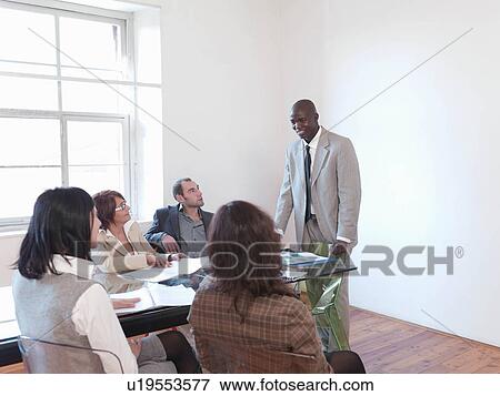 Stock Photo - Businessman giving presentation. Fotosearch