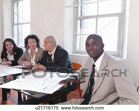 Businesspeople in conference room View Large Photo Image Stock Photography - Businesspeople in conference room. Fotosearch