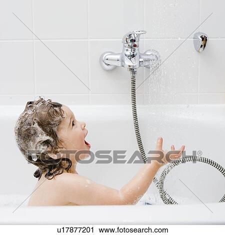 Stock Image - Child in the bathtub. Fotosearch