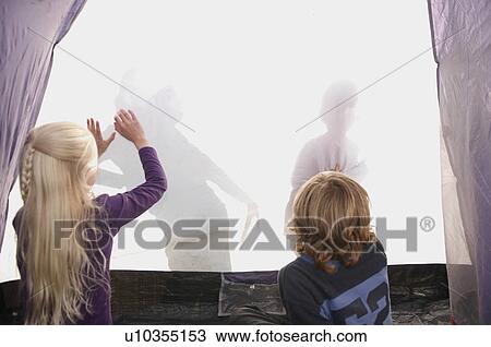 Children making shadows on tent View Large Photo Image Stock Image - Children making shadows on tent. Fotosearch