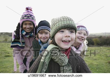 Stock Photo - Children playing in field. Fotosearch